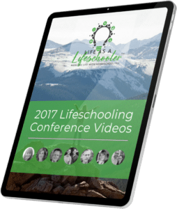 tablet with picture of lifeschooling conference video speakers and mountains in background.