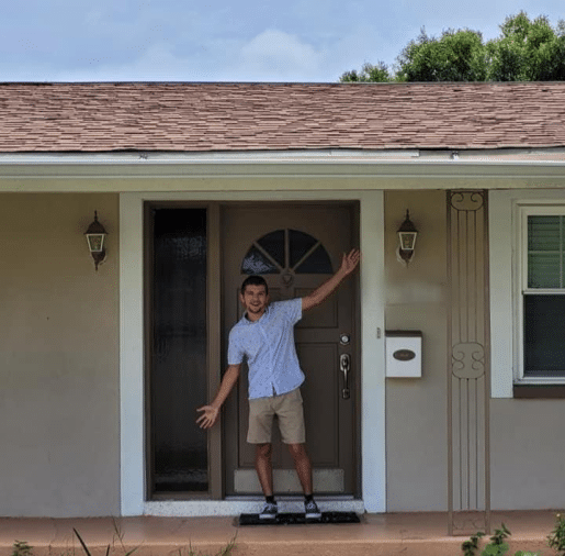 Nick Arl in front of his house