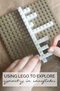 white lego snowflake on a brown lego background