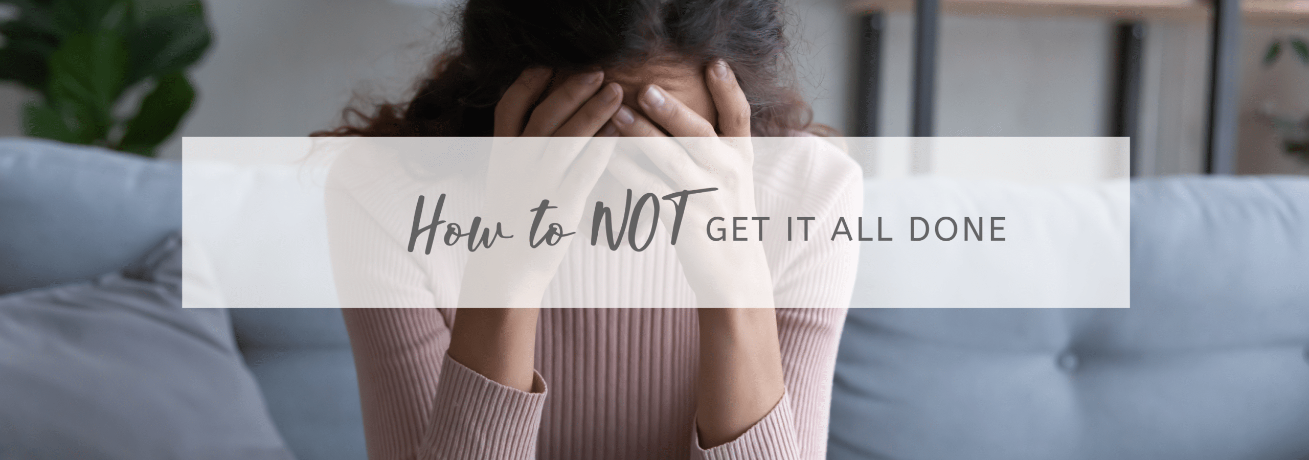 stressed lady with her head in her hands