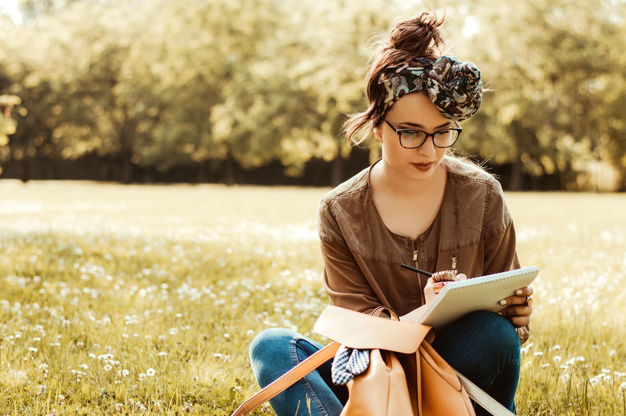 mother writing in her journal to destress