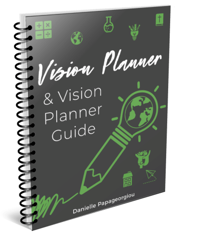gray and green spiral-bound vision planner
